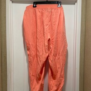 Bright orange colored jogger pants
